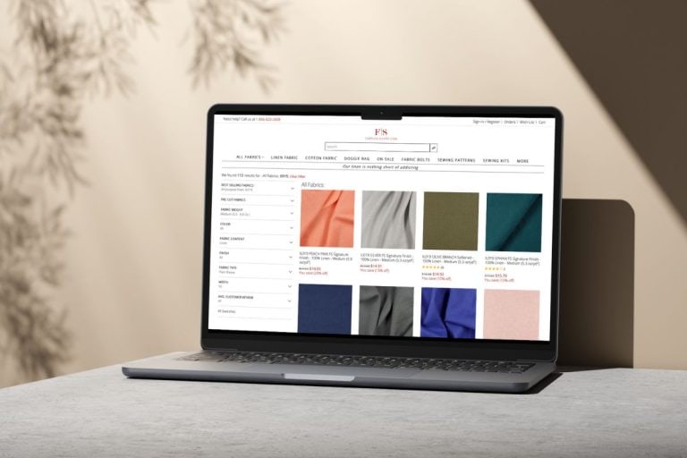 Fabrics-store.com website on a laptop mockup.